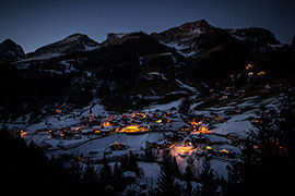 swiss village in mountains at night